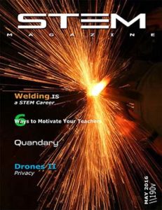 A welder sparks bright orange flames during welding work.